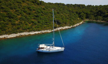 A SECLUDED BAY WITH ELAN IMPRESSION 494 WILD WIND - SAILING IN CROATIA