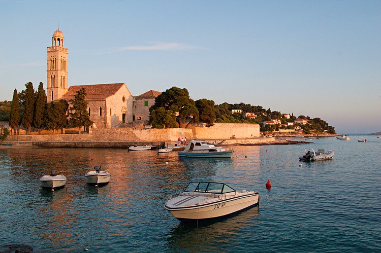 Hvar boats and Franciscan Monastery