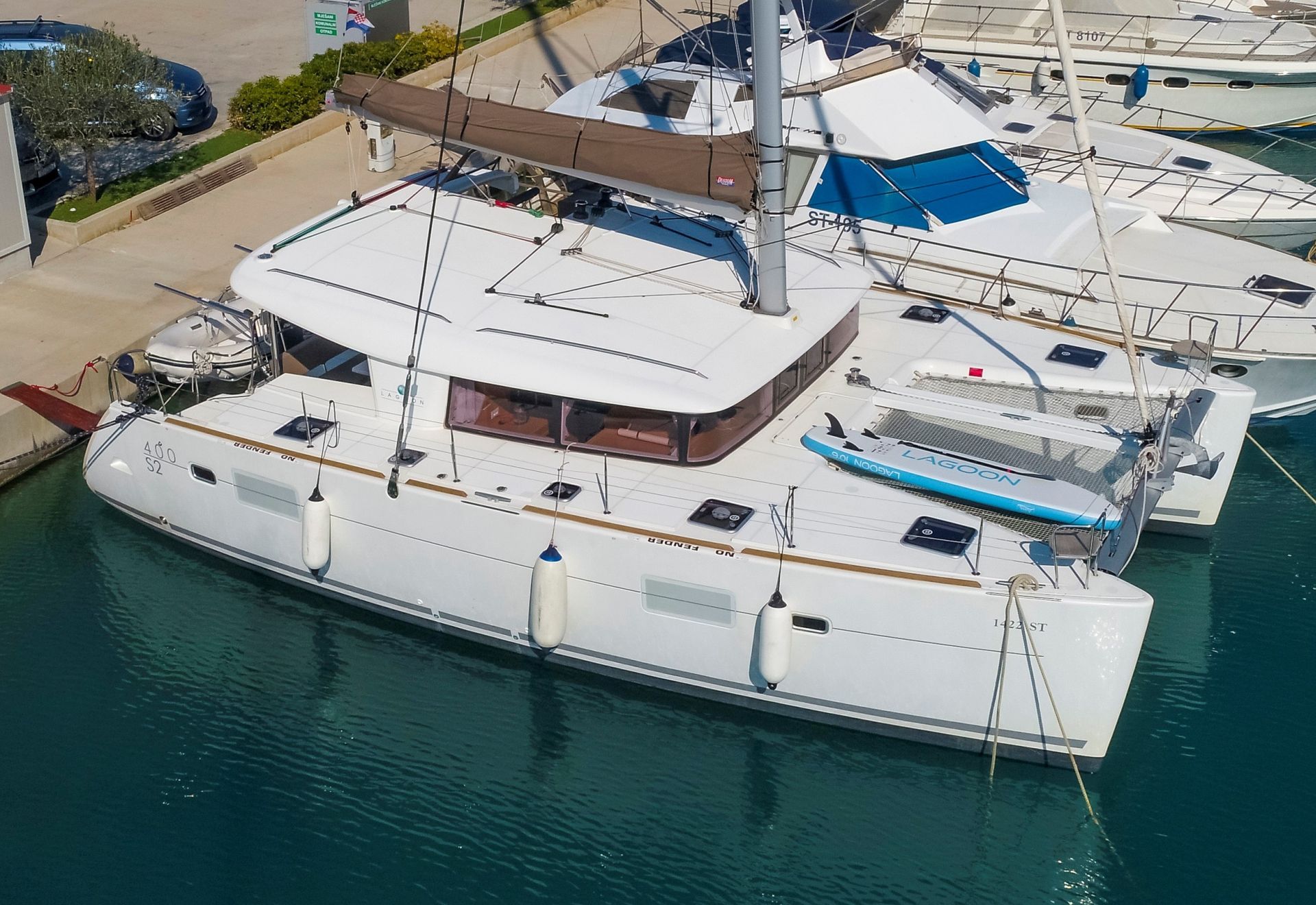 Lagoon 400S2 Second Wind from the air parked in marina