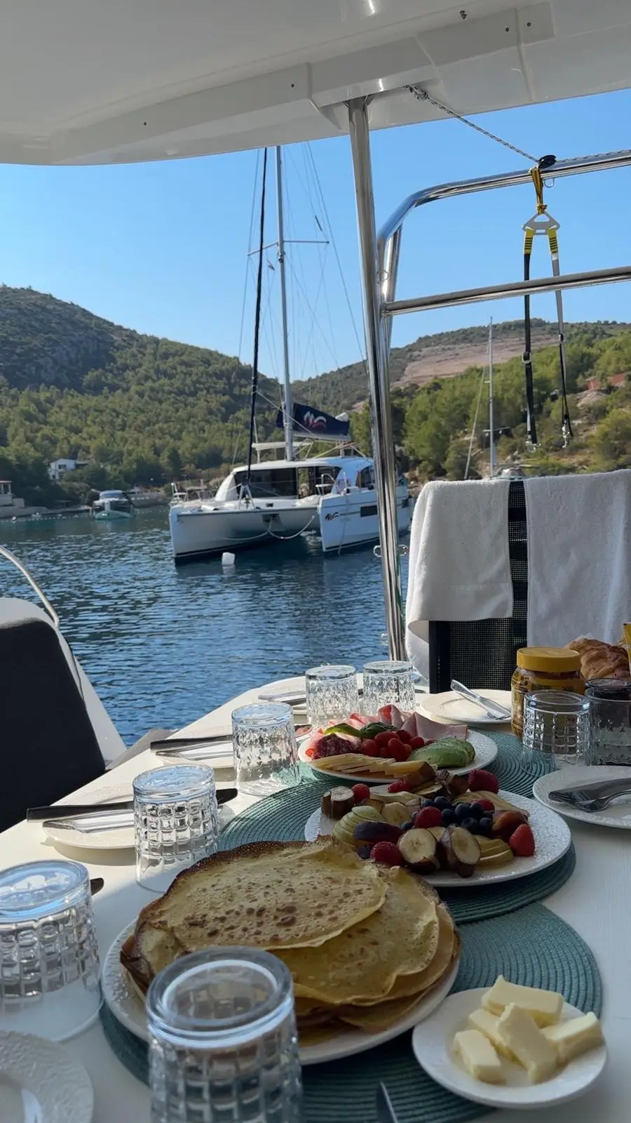 Breakfast served on a yacht near a quiet Croatian bay